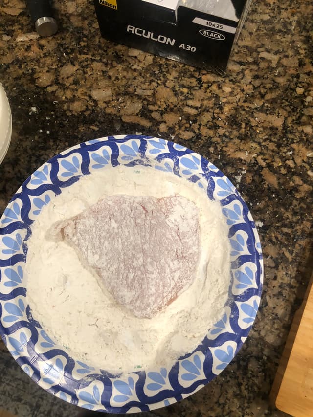 A flour-coated chicken breast