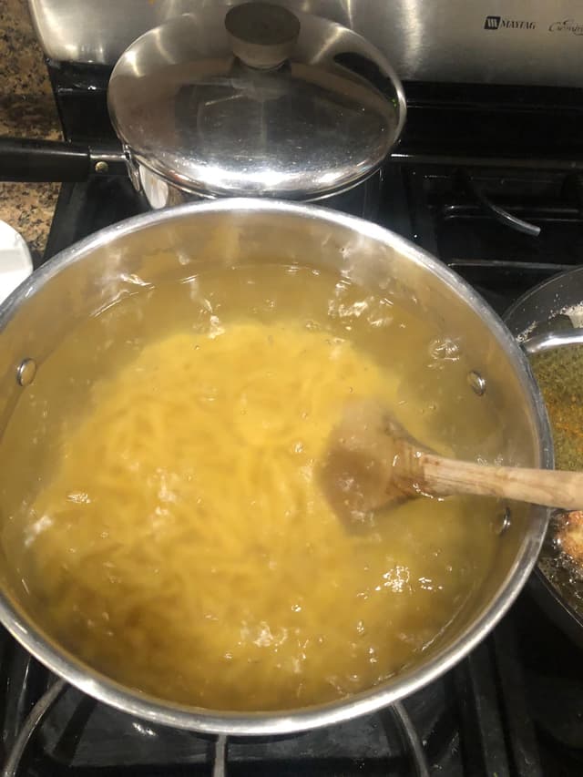 Putting pasta in the boiling water